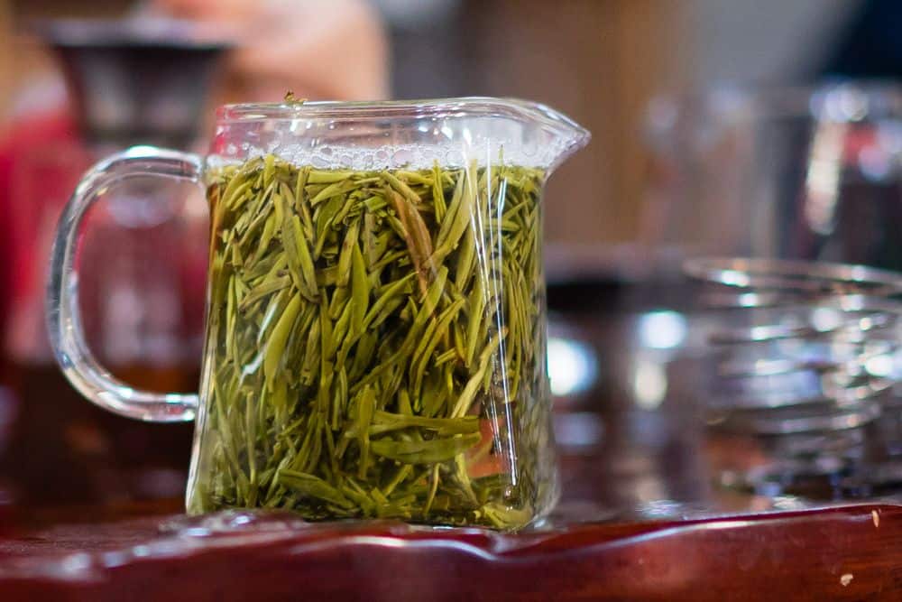 green tea leaves brewing